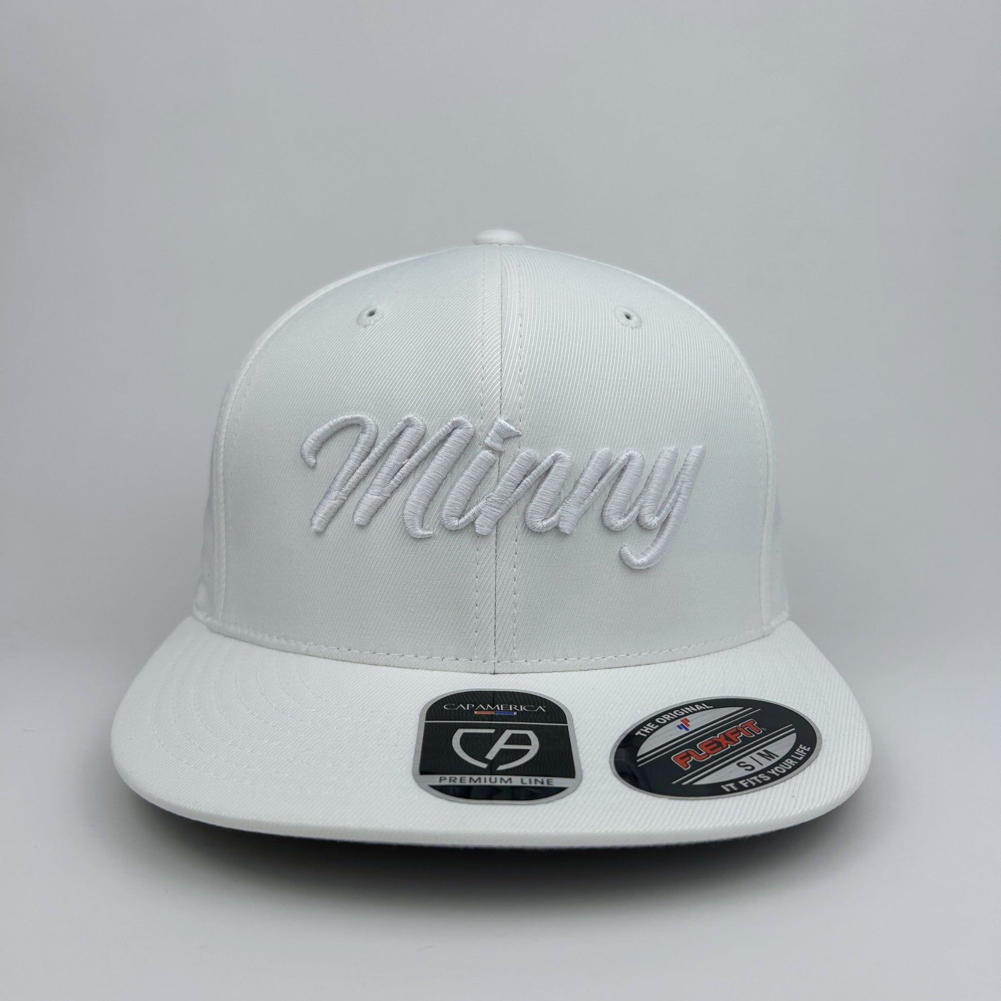 White cap with 'Minny' embroidery on a gray background