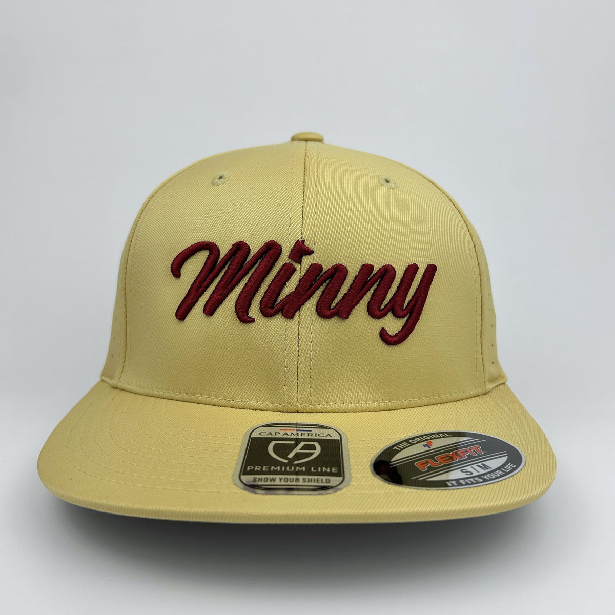 Beige cap with 'Minny' in red text on a white background
