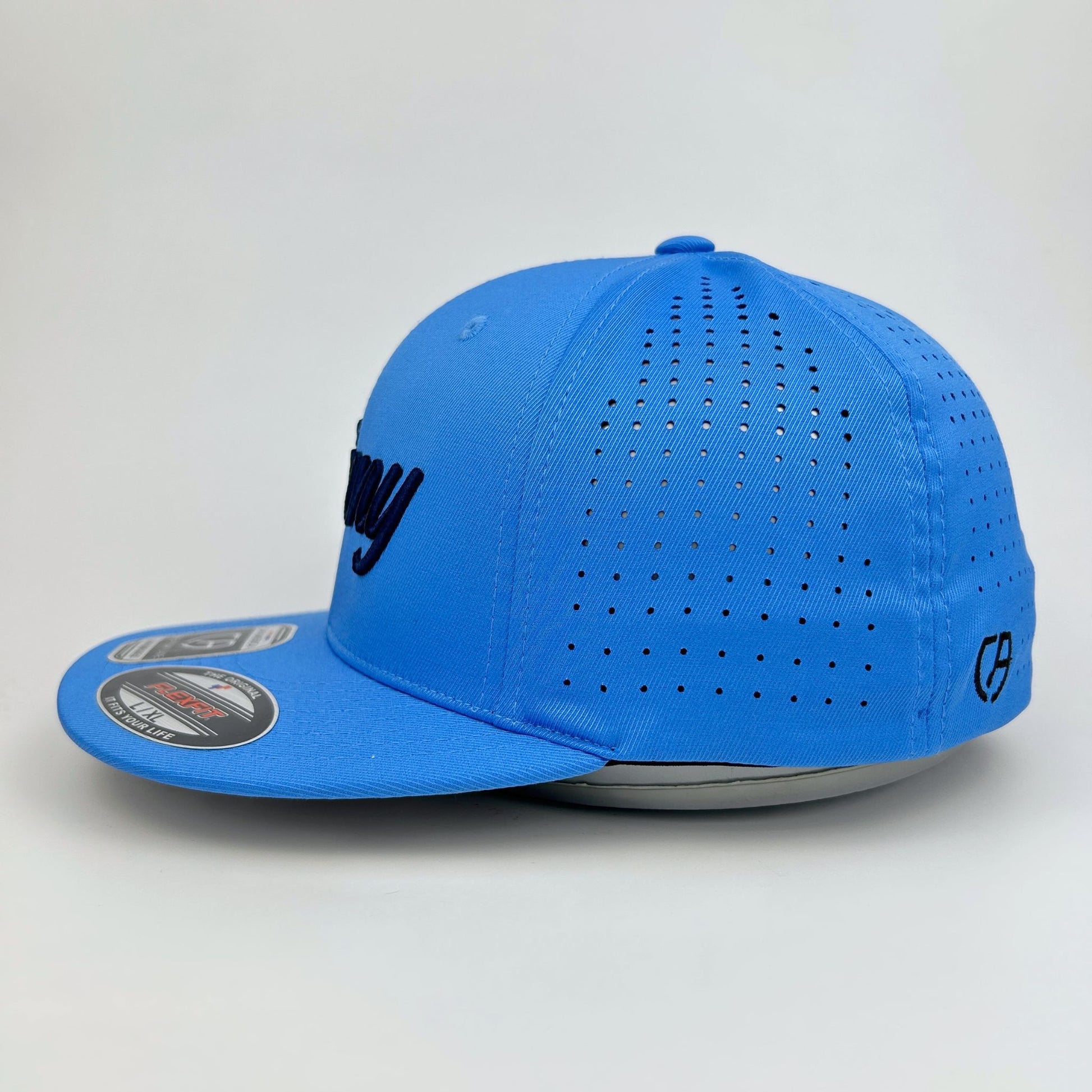 Blue baseball cap with perforated design on a light gray background