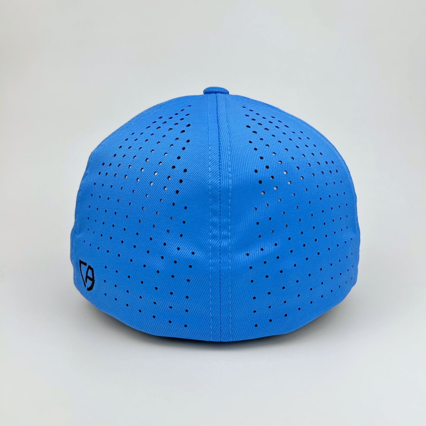 Blue cap with perforated design on a light gray background