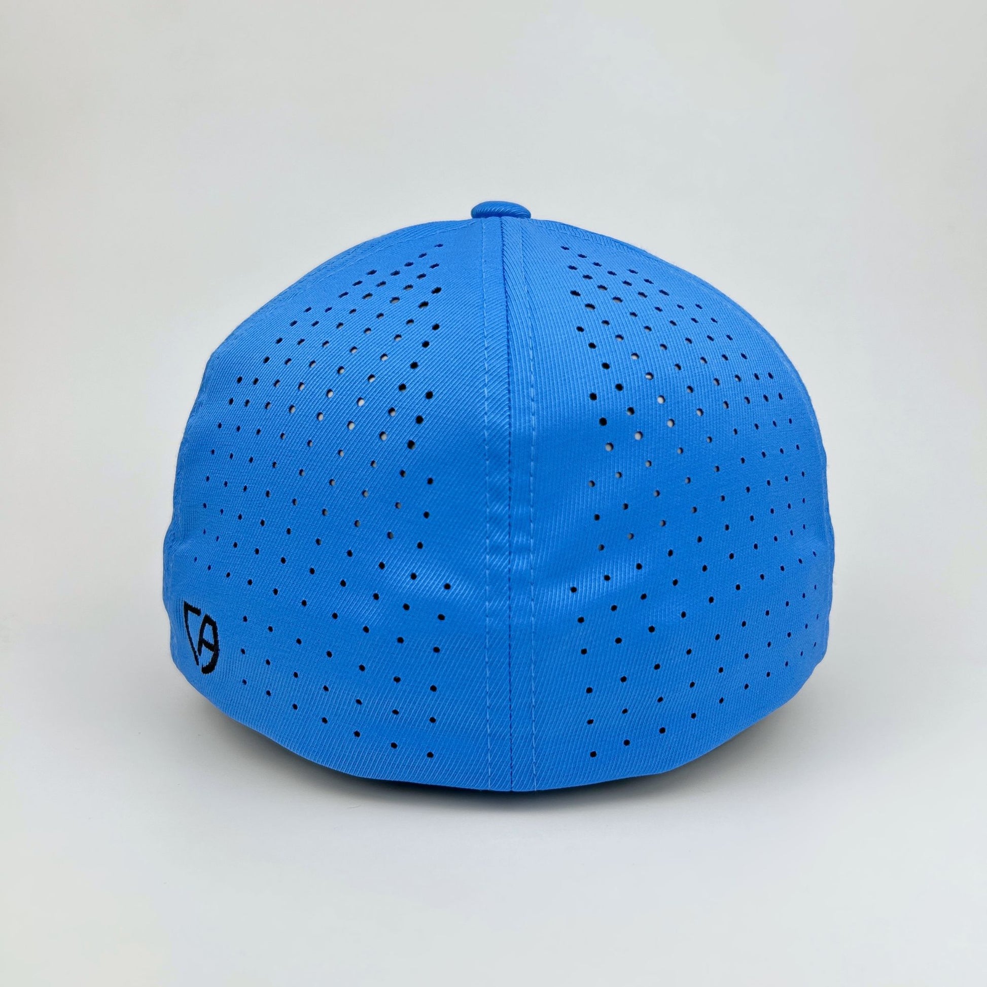 Blue cap with perforated design on a light gray background
