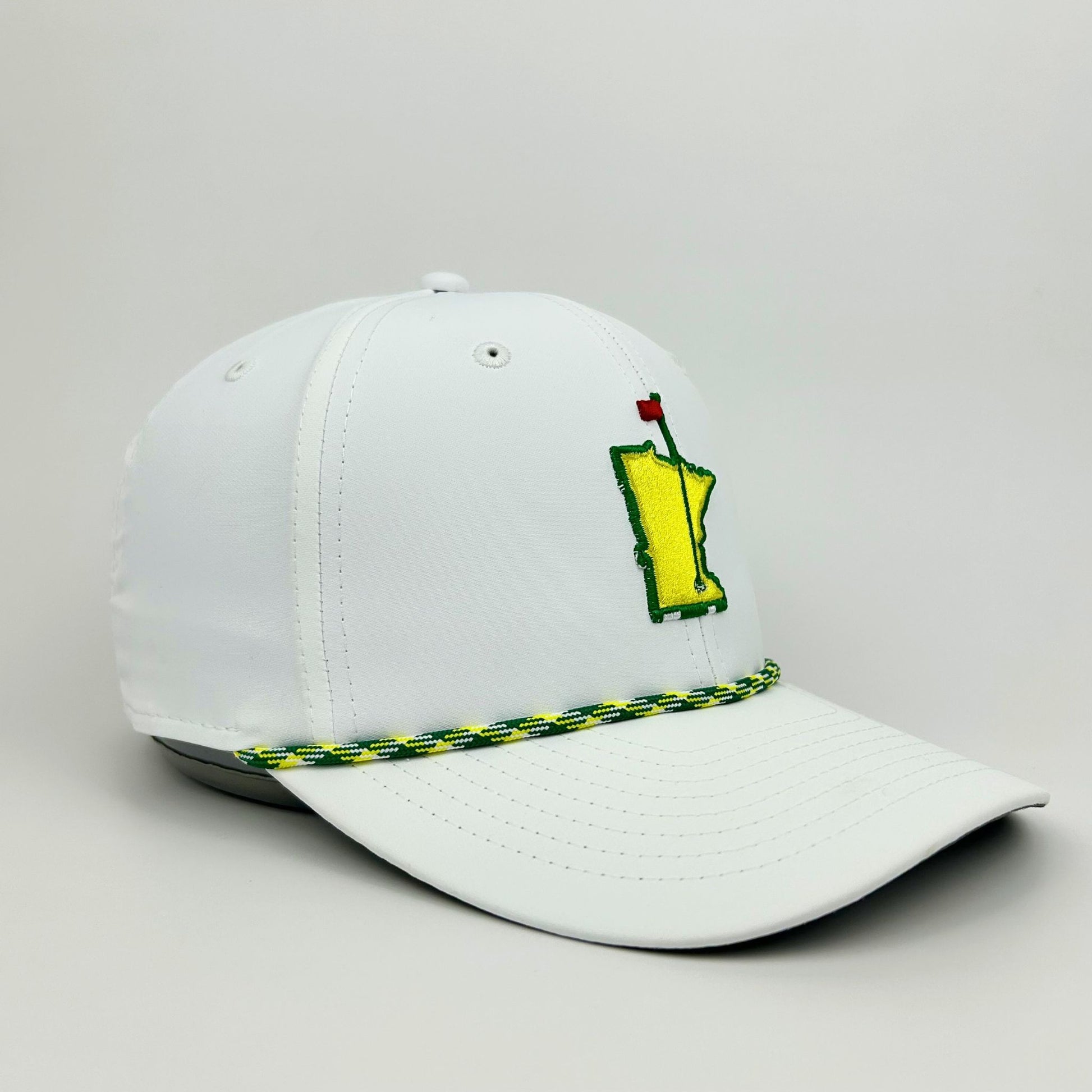 White cap with a green and yellow logo on a light gray background