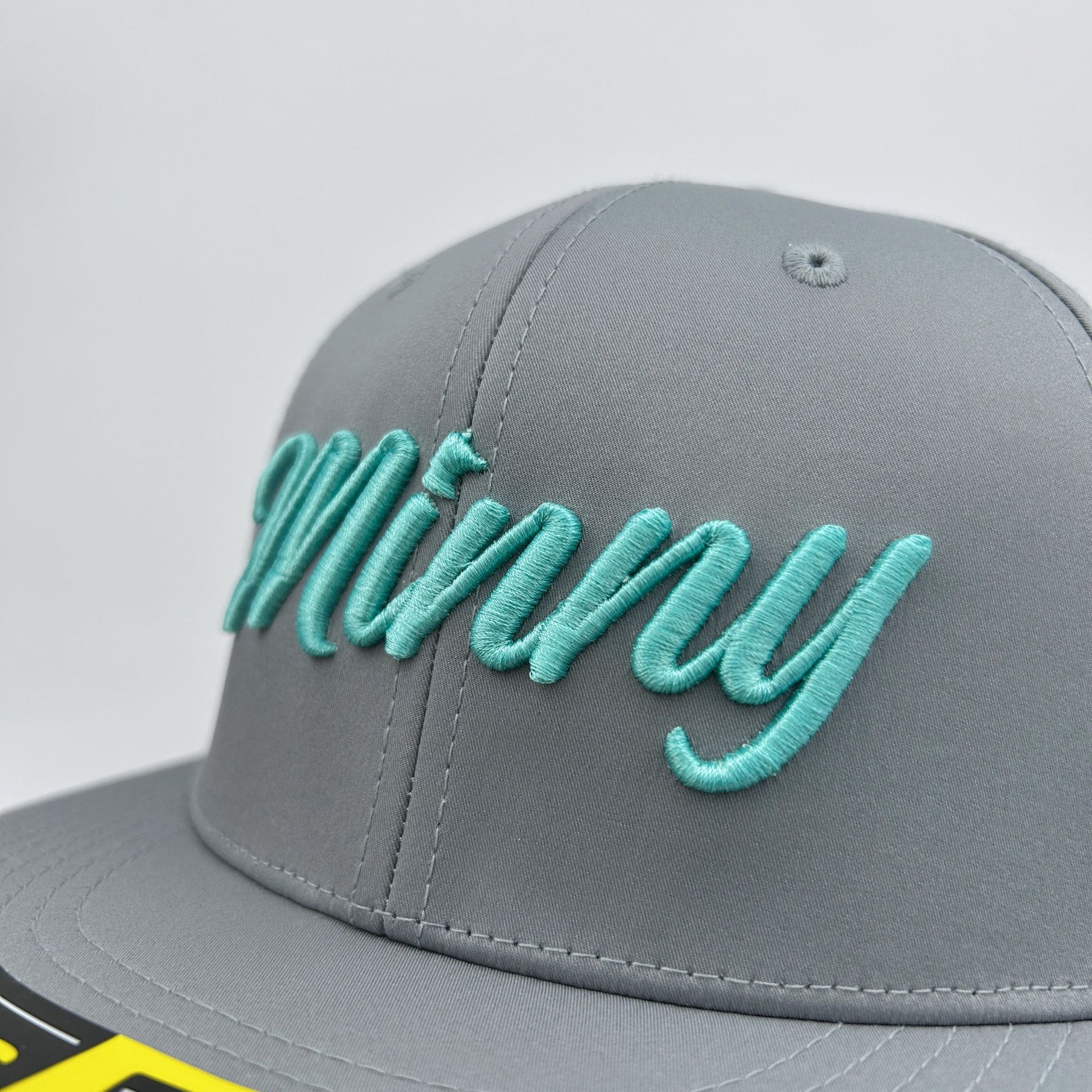 Gray cap with mint text on a light gray background