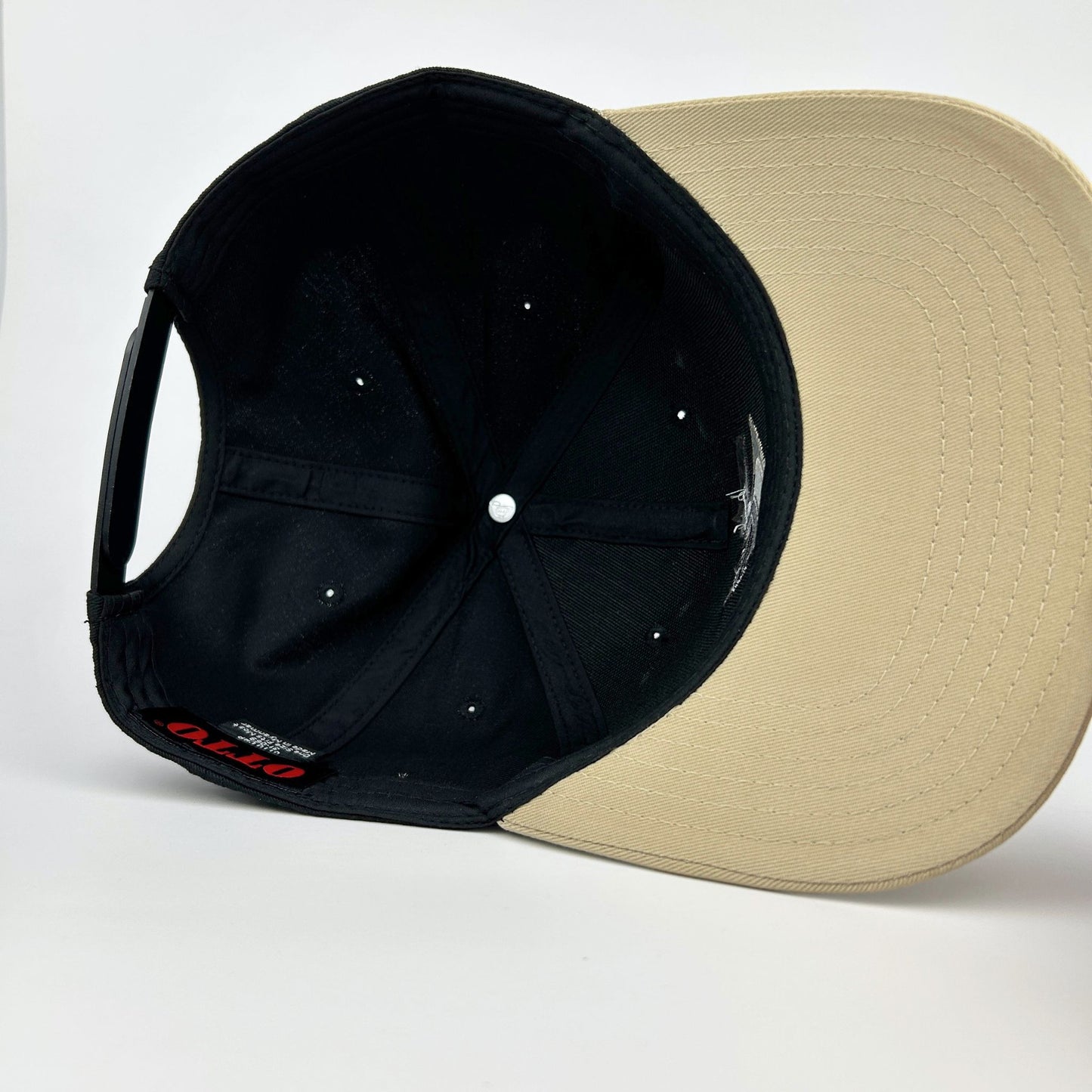 Black and beige cap on a white background