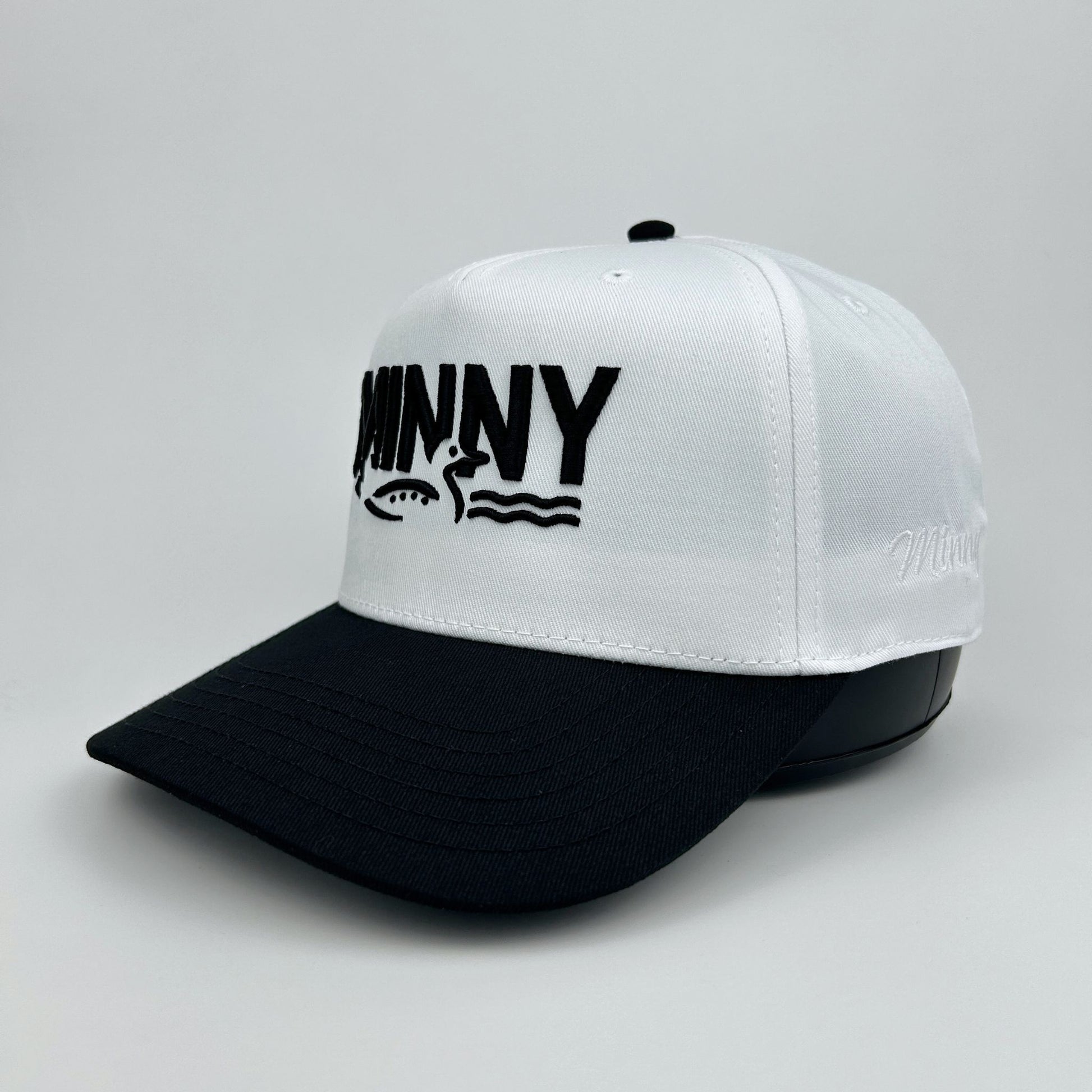 White and black cap with 'MINNY' logo on a gray background